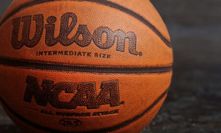 Wilson NCAA basketball on black board