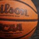 Wilson NCAA basketball on black board